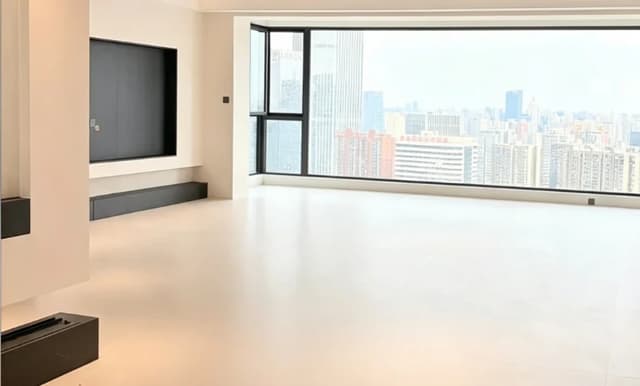 Large format light porcelain floor tiles in a bright city apartment living room