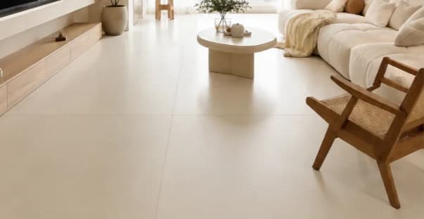 Large format beige porcelain floor tiles in a bright modern living room