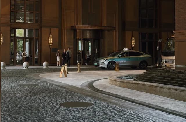 Commercial tile flooring at a hotel entrance with vehicle and pedestrian traffic