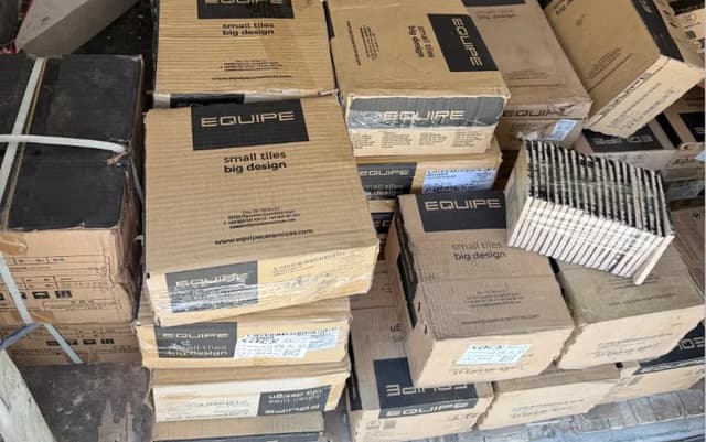 Stacked cartons of small-format ceramic tiles prepared for warehouse handling