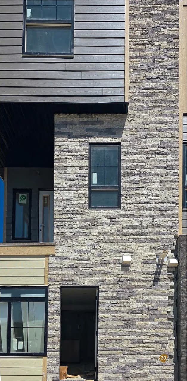 Straight-cut stone used across a building exterior