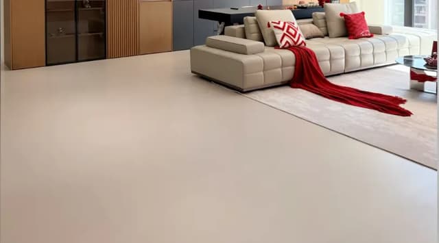 Large-format beige porcelain floor tiles in a contemporary living room
