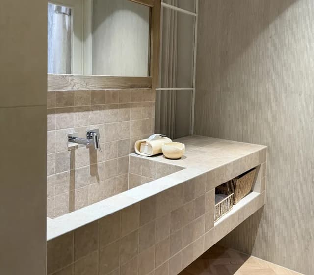 Beige ceramic wall tiles in a contemporary bathroom specification setting