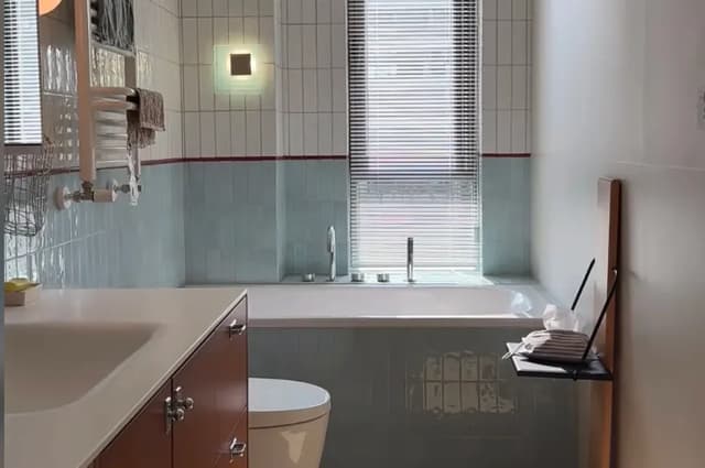 Blue and white subway tiles in a contemporary bathroom
