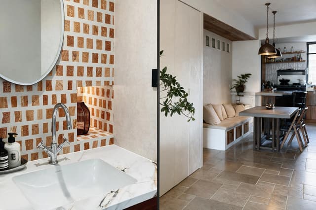 Coordinated bathroom and living-area tiles in a completed Dubai apartment