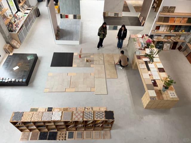 Tile samples reviewed in a showroom for a multi-unit Dubai apartment project