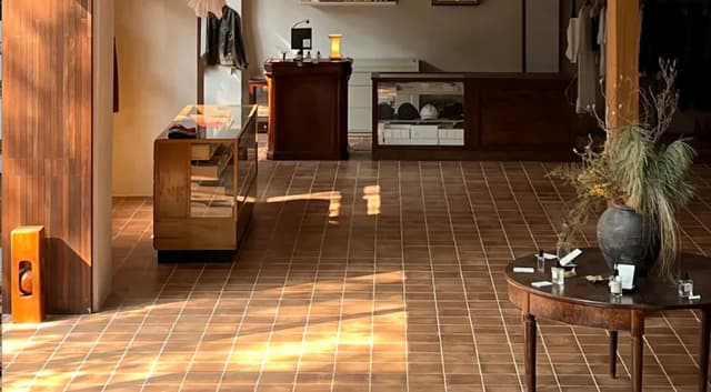 Completed Ho Chi Minh City retail interior with a continuous warm tile floor
