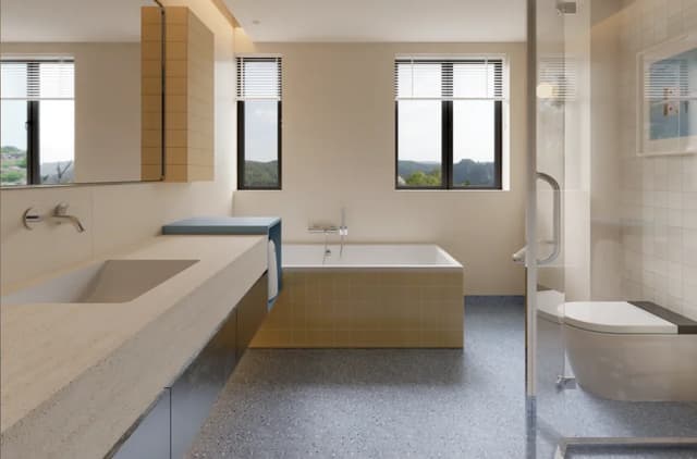 Contemporary bathroom combining small wall tiles with a terrazzo-look floor