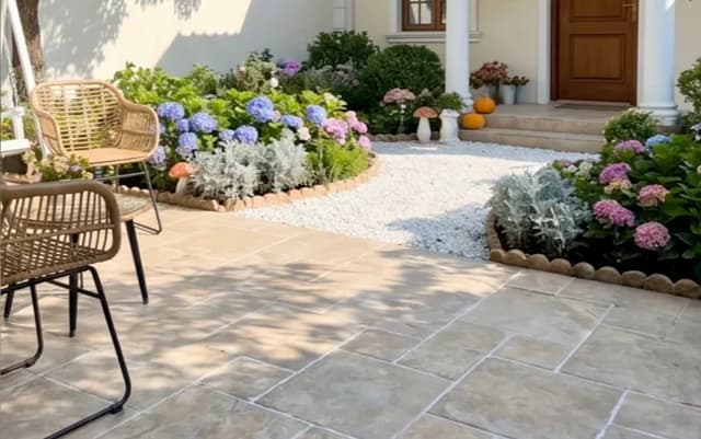 Light rustic floor tiles on a landscaped garden patio