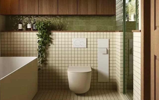 Bathroom walls with white and green tiles arranged in aligned stacked grid layouts