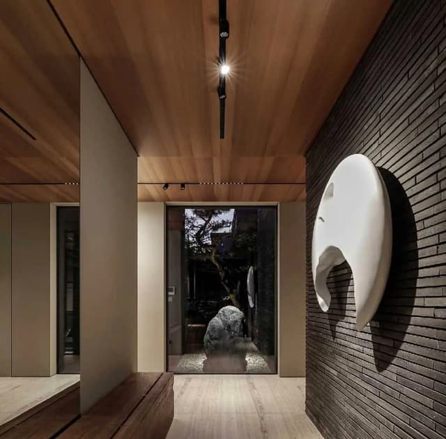 Back-mesh brick veneer used in an interior corridor